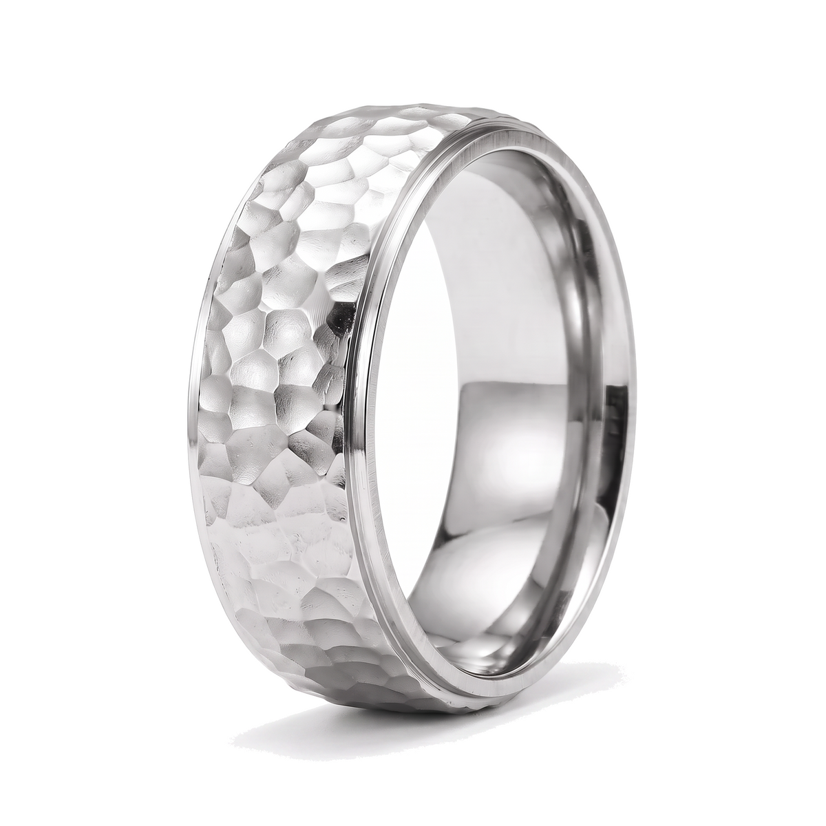 The Crater silver stainless steel ring with a beat forged hammered surface on a white background