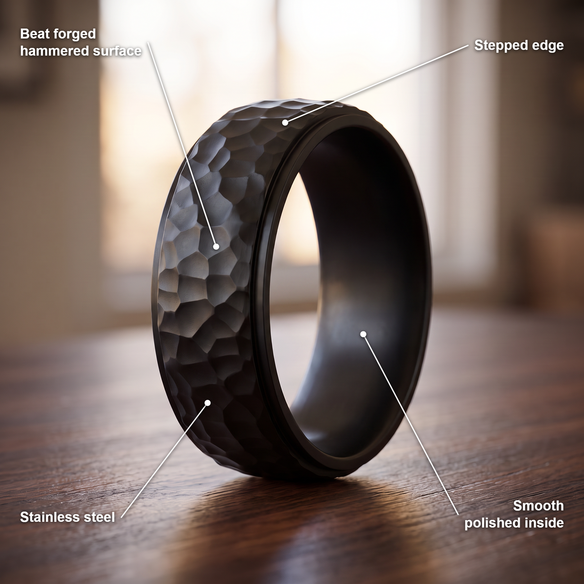 The Crater ring details in black: beat forged hammered surface, stepped edge, stainless steel, smooth polished inside