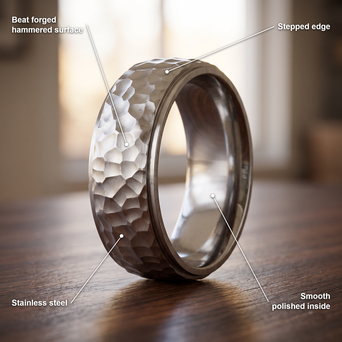 The Crater ring details in silver: beat forged hammered surface, stepped edge, stainless steel, smooth polished inside