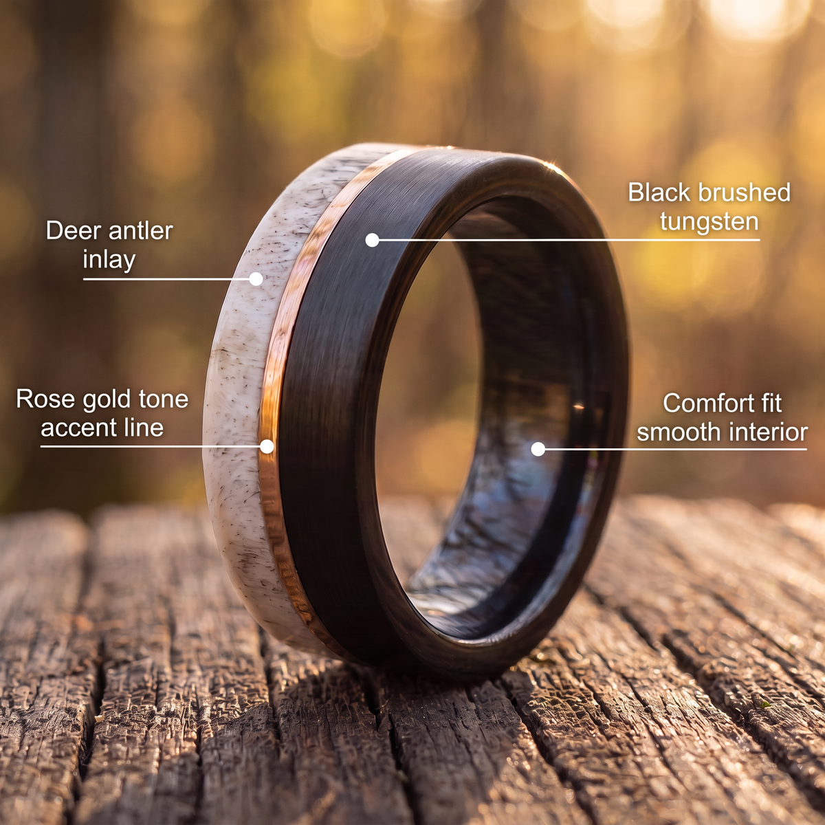 The Stag ring on weathered wood with callouts for deer antler inlay, rose gold tone line, black brushed tungsten and comfort fit interior