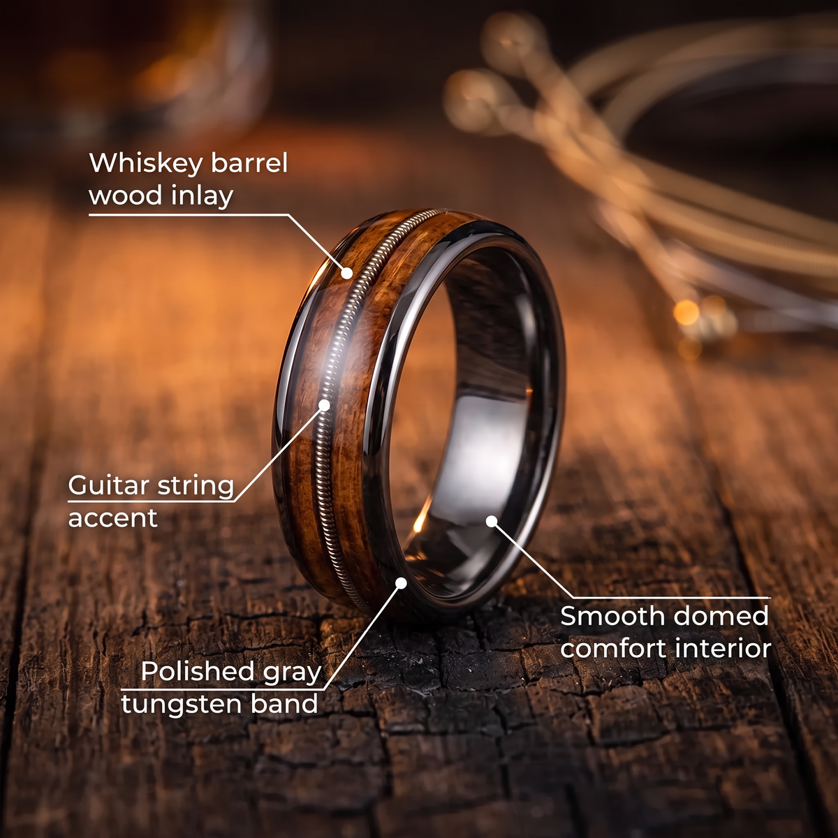 The Roadhouse ring features: whiskey barrel wood inlay, guitar string accent, polished gray tungsten band, domed comfort interior