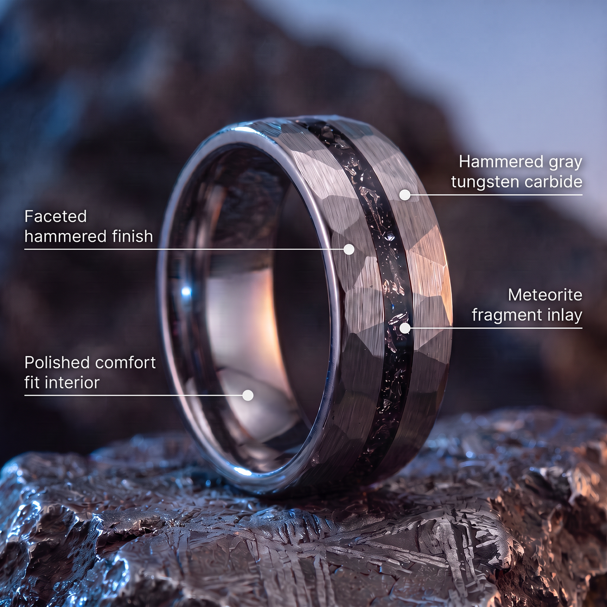 The Meteor ring materials: hammered gray tungsten carbide, meteorite fragment inlay, faceted hammered finish, polished comfort fit interior