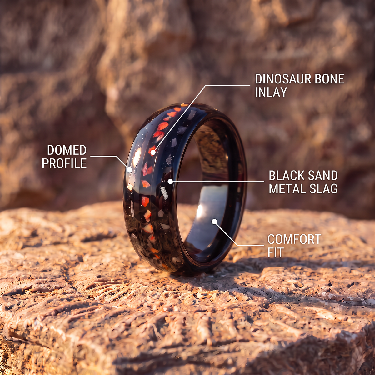 Black tungsten ring on fossil rock with callouts for dinosaur bone inlay, black sand metal slag, domed profile and comfort fit