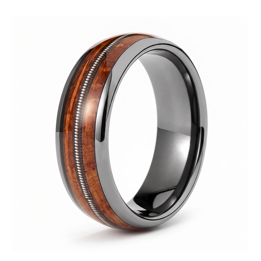 The Roadhouse domed gray tungsten ring with whiskey barrel wood inlay and guitar string on a white background