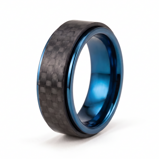 The Spinner ring with a rotating carbon fiber outer band and a polished blue stainless steel core on a white background
