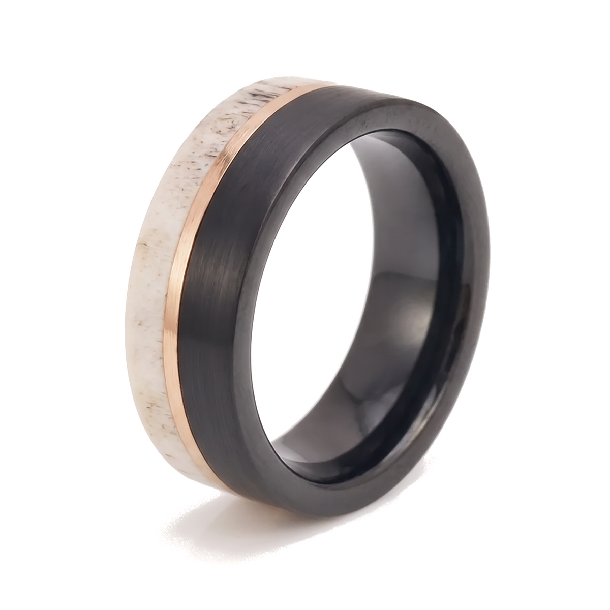 The Stag black brushed tungsten ring with deer antler inlay and rose gold line on a white background