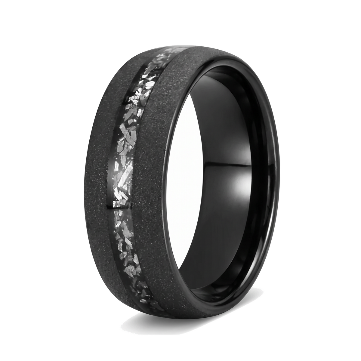 The Stardust black sandblasted tungsten ring with an off center meteorite inlay on a white background