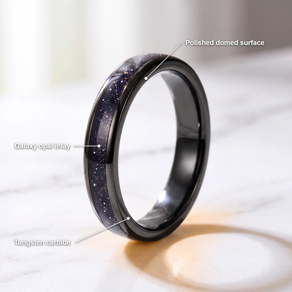 The Vega black tungsten ring with a galaxy opal inlay and feature callouts